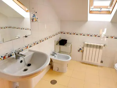 a bathroom with a sink and a toilet at Casa Sueño in Foz
