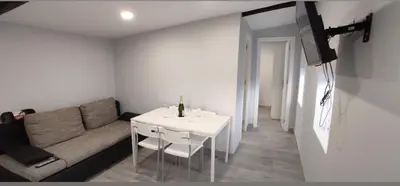 a living room with a couch and a table at Casa rural La casilla de Ois-Betanzos-A Coruña in Coirós