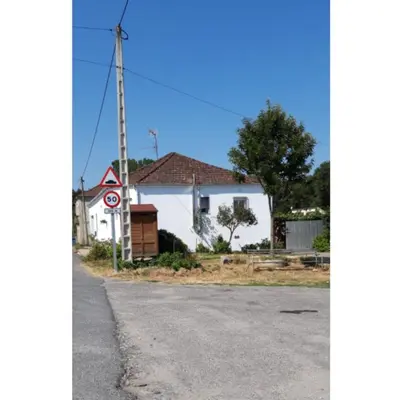 a white house on the side of a road at CASA 