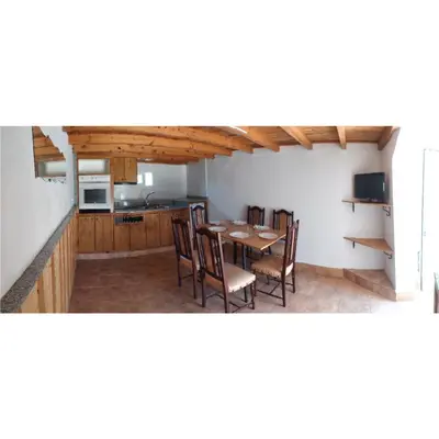 a kitchen and dining room with a table and chairs at CASA 