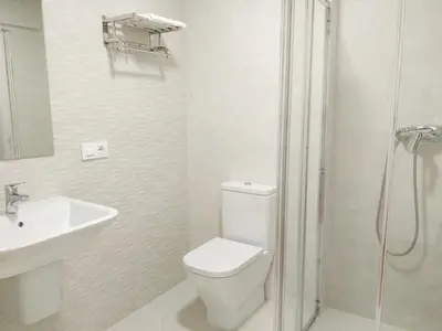 a bathroom with a toilet and a sink and a shower at Vía Sacra in Porta