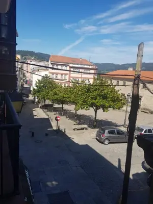 a view of a parking lot with a building at Hospedaje Norte in Puentedeume