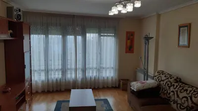 a living room with a couch and a table at Piso Tranquilo Ponferrada in Ponferrada
