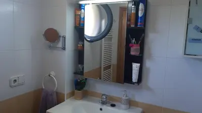 a bathroom with a sink and a mirror at Piso Tranquilo Ponferrada in Ponferrada