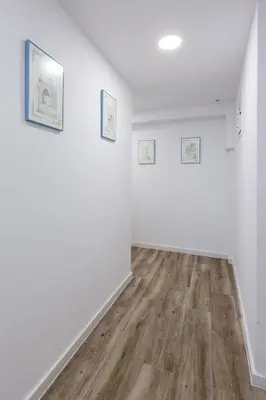 an empty room with white walls and wooden floors at MIRADOR DE LA MURALLA in Betanzos