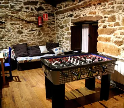 a room with a table with a chess board on it at Casa Rural Madreselva in Navelgas
