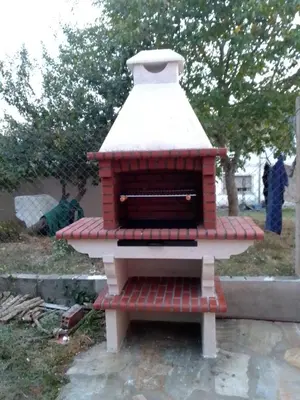 a red brick oven with a white roof at CASA NIDES in Doade