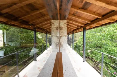 a glass house in the middle of a forest at Casa de lujo en la Ribeira Sacra in Acova