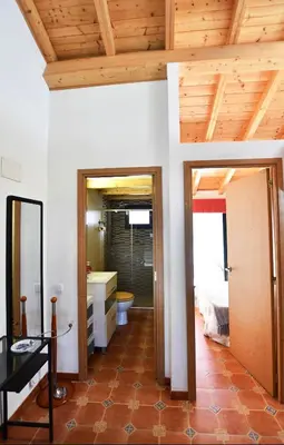 a room with a bathroom with a bed and a toilet at Casa da Ponte in Monforte de Lemos