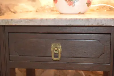 a wooden table with a drawer with a vase on it at Airiños de Mondariz in Mondariz