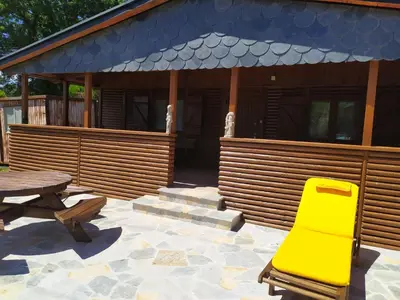 a log cabin with a stone path in front of it at Casas de madera 