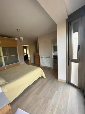 a bedroom with a bed and a large window at Casa nueva con jardín y wifi en Ribeira Sacra in Castrelo
