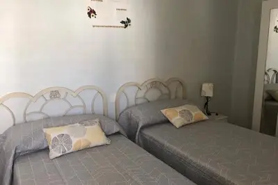 two beds sitting next to each other in a bedroom at cuartin del camino in Ponferrada