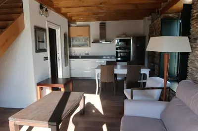a living room with a couch and a table at A Palleira de Lola in Lugo