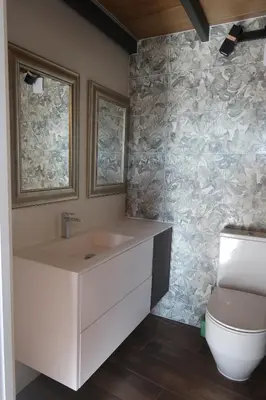 a bathroom with a sink and a toilet at A Palleira de Lola in Lugo