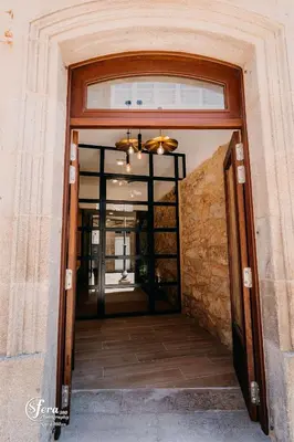 an entrance to a building with a glass door at Apartamentos Rúa Vella in Caldas de Reis