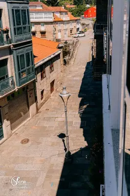 an overhead view of a street with a street light at Apartamentos Rúa Vella in Caldas de Reis
