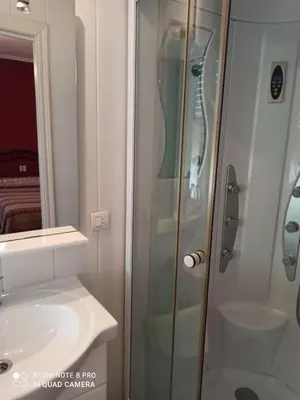 a bathroom with a shower and a sink at PENSION LA PARADA in Fabero