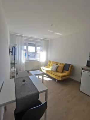 a living room with a couch and a table at Seijo in Villalba