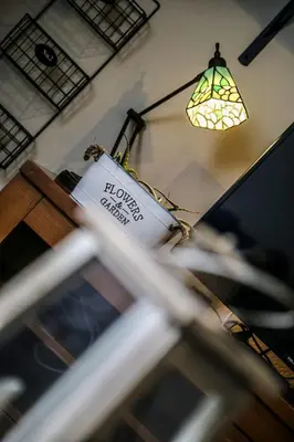 a light hanging from a wall with a sign on it at Casa de Arriba in Rinlo