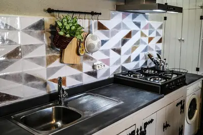 a kitchen with a sink and a stove at Casa de Arriba in Rinlo