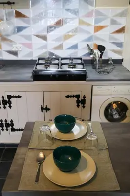a kitchen with two green bowls on a table at Casa de Arriba in Rinlo
