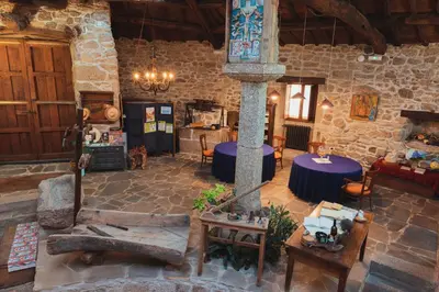 an aerial view of a stone building with tables and chairs at Casa Do Romualdo in Vilela