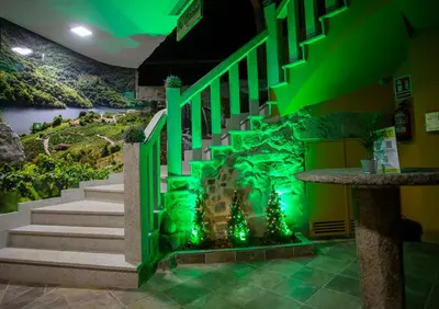a staircase in a building with a giraffe mural at Apartamentos Casa dos Arcos in Sober