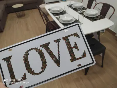a table with a sign that says exit at Huellas Albergue-Turístico in Portomarin