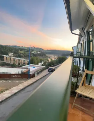 a view from the balcony of a building at Huellas Albergue-Turístico in Portomarin