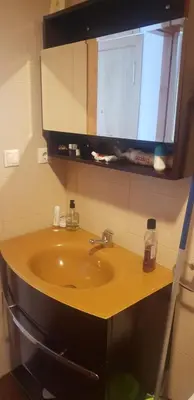 a bathroom with a sink and a mirror at Piso con piscina en Sada in Sada