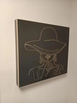 a drawing of a hat on a black board at Pensión Boutique ADMERA in Santiago de Compostela