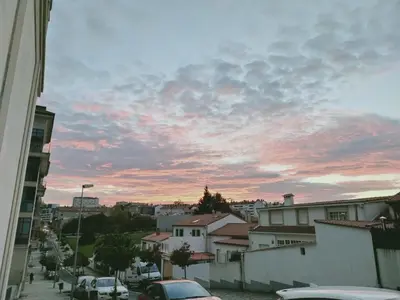 a view of a city street with a cloudy sky at Pensión Boutique ADMERA in Santiago de Compostela