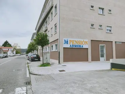 a sign on the side of a building at Pensión Boutique ADMERA in Santiago de Compostela