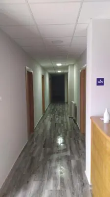 an empty hallway of an office building with a hallway at PENSIÓN CASA ANTONIO in Pantón