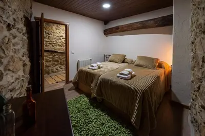 a bedroom with a bed with towels on it at Casa Pion in Sober