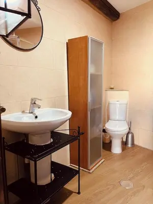 a bathroom with a sink and a toilet at Casa rural entre Santiago Compostela y La Coruña in Ordes