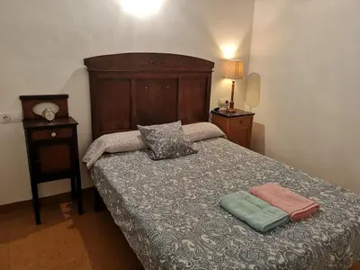 a bedroom with a bed with two pillows on it at casa ferreirua in Ferreirúa