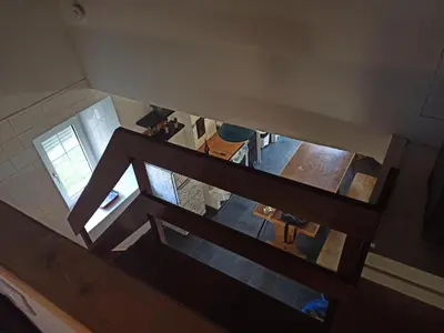 an overhead view of a kitchen with a staircase in a house at casa ferreirua in Ferreirúa