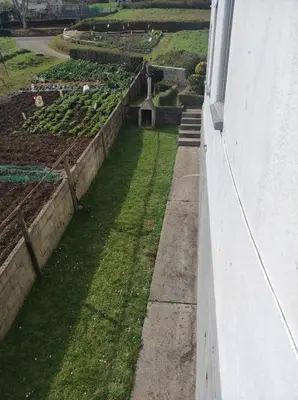 a view of a garden from the balcony of a building at Casa familiar con finca privada (Orolterra) in Viveiro