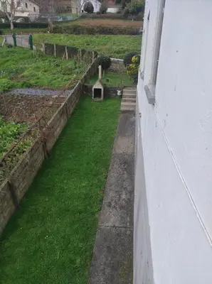 a view of a garden from the side of a building at Casa familiar con finca privada (Orolterra) in Viveiro