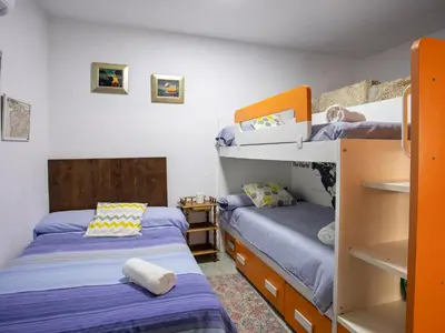 two bunk beds in a room with two beds at QUINTA do SOUTO BARCIADEMERA in Barciademera