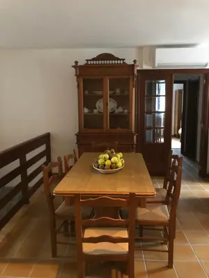 a dining room table with a bowl of fruit on it at QUINTA do SOUTO BARCIADEMERA in Barciademera
