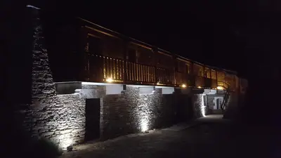 a train on a bridge at night at Casa Berdeal in Santa María