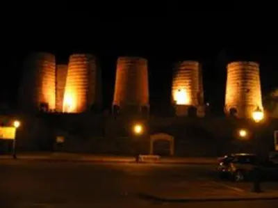 a group of silos lit up at night at Hotel San Briz in A Pontenova