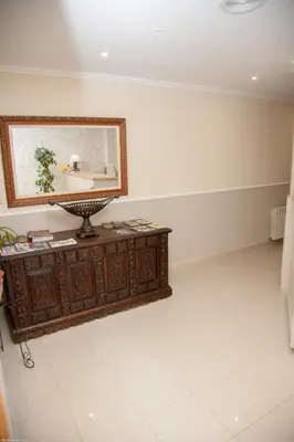 a room with a mirror on top of a dresser at Hotel San Briz in A Pontenova