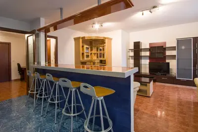a bar with stools in a room at U-Hotel Darío Lugo in Lugo