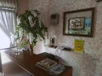 a room with a table and a vase of flowers at Arume in Bóveda