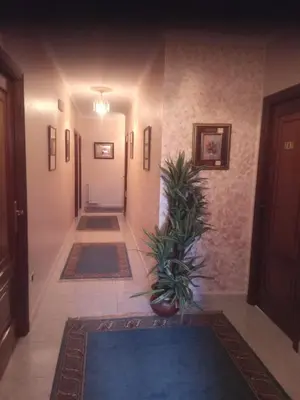 a hallway with two rugs on the floor of a house at Arume in Bóveda