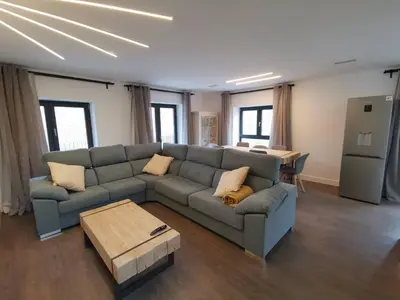 a living room with a couch and a table at VILLA MAREL in Trefacio